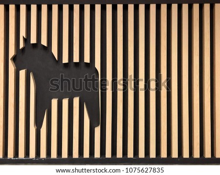 Abstract picture of unicorn like and stripe wood use to decorate wall in the shop