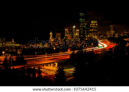 Night city view of Seattle city scape at night time,Long Exposure picture of Downtown Seattle, USA.
