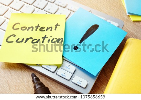 Content Curation. Memo stick on a keyboard.