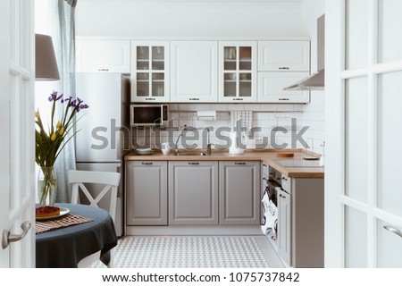 Scandinavian interior design. White grey kitchen room organization Royalty-Free Stock Photo #1075737842