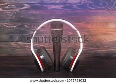 microphone and headphones on a dark background