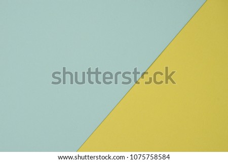 textured papered background, flat lay, minimal style in pastel color tone of  green and  yellow 