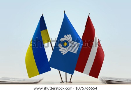Flags of Ukraine CIS and Latvia. Cloth of flags is 3d rendering, the rest is a photo.