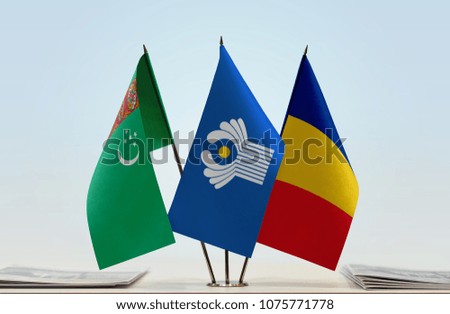 Flags of Turkmenistan CIS and Romania. Cloth of flags is 3d rendering, the rest is a photo.
