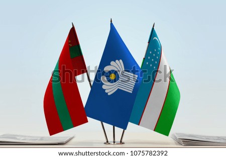 Flags of Transnistria CIS and Uzbekistan. Cloth of flags is 3d rendering, the rest is a photo.