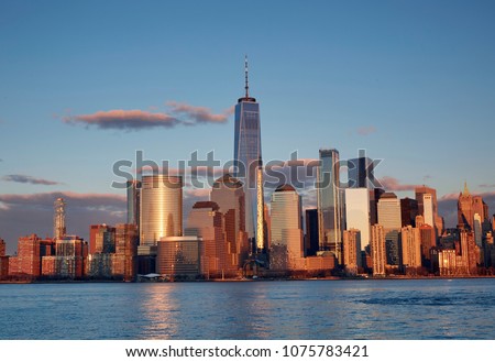 The World famous skyline of downtown Manhattan, New York City at sunset