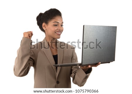 young woman holding a laptop while showing victory sign. isolated on white background