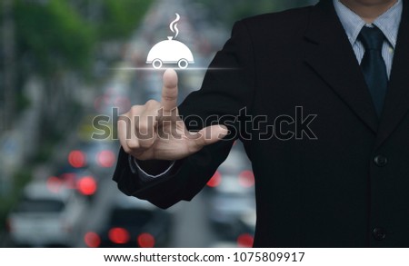 Businessman pressing restaurant cloche flat icon over blur of rush hour with cars and road, Food delivery concept