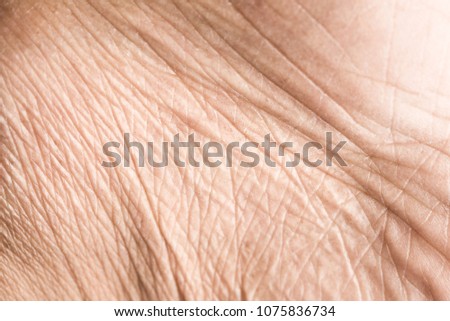 Close up skin texture with wrinkles on body human Royalty-Free Stock Photo #1075836734