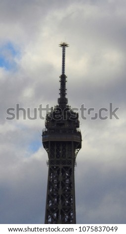 Extreme zoom of iconic Eiffel Tower tip revealing great detail, Paris, France   