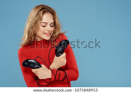 happy woman with two wired joysticks                             