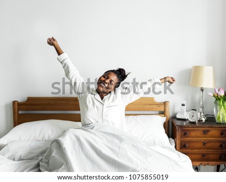 A woman waking up Royalty-Free Stock Photo #1075855019