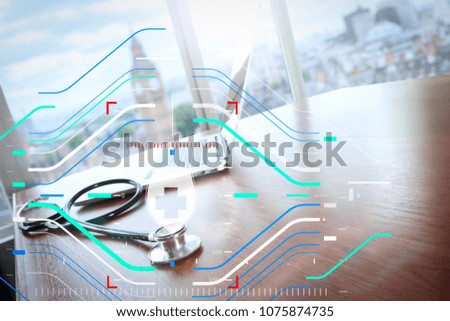 Health protection. Medical and health care concept.stethoscope and laptop computer on wood table and london bigben blurred background copy space

