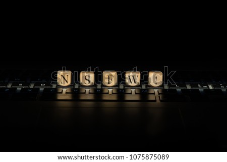 Nsfw word on wooden cubes. Nsfw concept Royalty-Free Stock Photo #1075875089