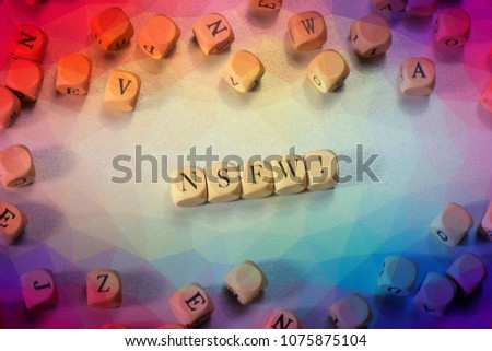 Nsfw word on wooden cubes. Nsfw concept Royalty-Free Stock Photo #1075875104