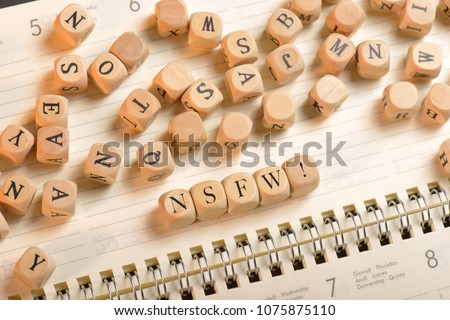 Nsfw word on wooden cubes. Nsfw concept Royalty-Free Stock Photo #1075875110
