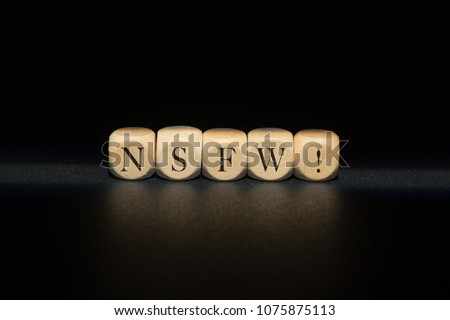 Nsfw word on wooden cubes. Nsfw concept Royalty-Free Stock Photo #1075875113