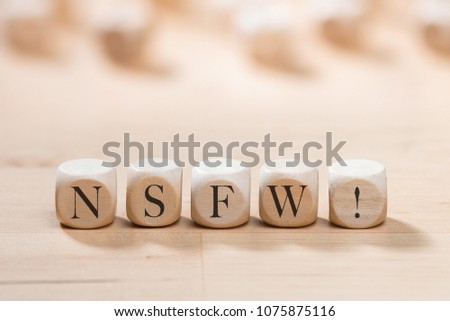 Nsfw word on wooden cubes. Nsfw concept Royalty-Free Stock Photo #1075875116
