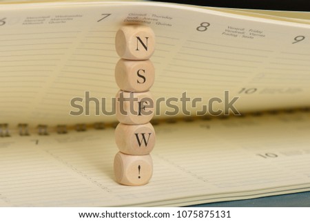 Nsfw word on wooden cubes. Nsfw concept Royalty-Free Stock Photo #1075875131