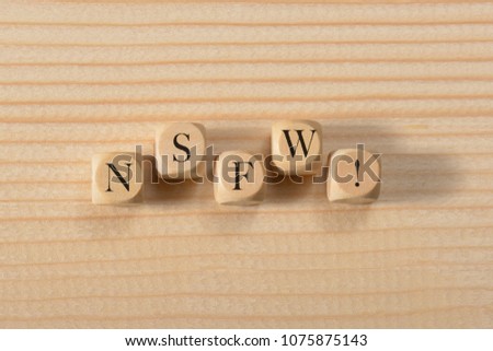 Nsfw word on wooden cubes. Nsfw concept Royalty-Free Stock Photo #1075875143