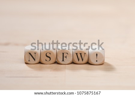Nsfw word on wooden cubes. Nsfw concept Royalty-Free Stock Photo #1075875167