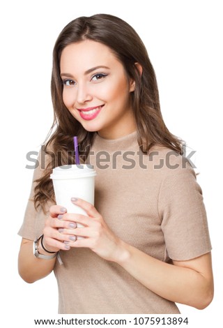 Portrait of a beautiful young brunette woman having coffee.