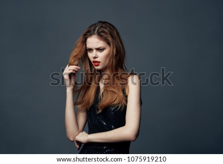 red-haired woman on a gray background                           