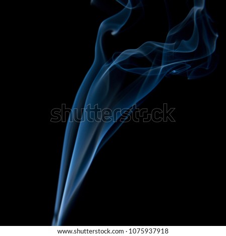 Blue smoke isolated on dark background. Abstract fumes.