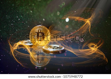 golden bitcoin cryptocurrency BTC burning hot Royalty-Free Stock Photo #1075948772