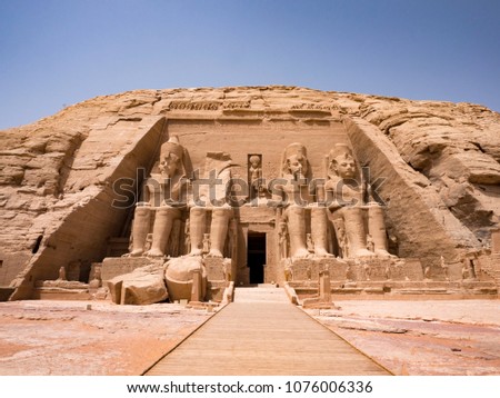 Statues in front of Abu Simbel temple in Aswan Egypt Royalty-Free Stock Photo #1076006336