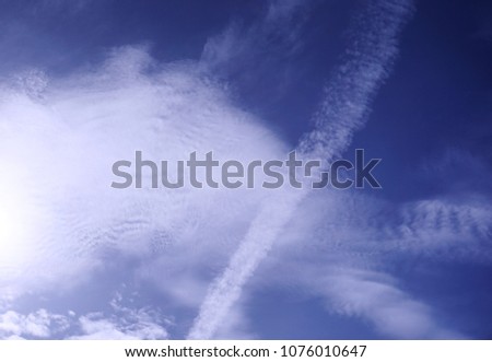 Altocumulus, Cirrocumulus and stratocumulus fluffy clouds on light blue sky background.            
                               