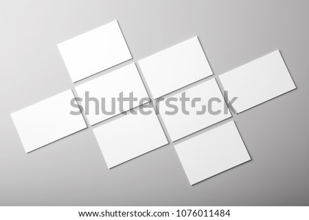 Photo of white business cards. Template for branding identity. For graphic designers presentations and portfolios. Business Card isolated on gray. White business card mock-up. Photo mock up.