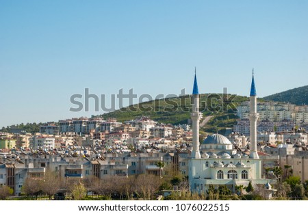 Milas, provinces of Mugla, Turkey -March 18, 2014:View of the mosque with minarets in the city of  Milas,Mugla provinces. Royalty-Free Stock Photo #1076022515