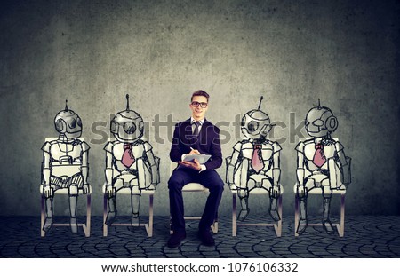 Human vs Robots concept. Business job applicant competing with artificial intelligence 