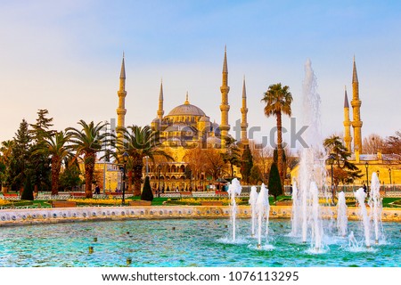 The Blue Mosque, (Sultanahmet Camii) with fountain on sunrise, Istanbul, Turkey. Royalty-Free Stock Photo #1076113295