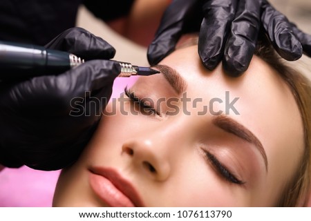 Permanent make up on eyebrows. Royalty-Free Stock Photo #1076113790