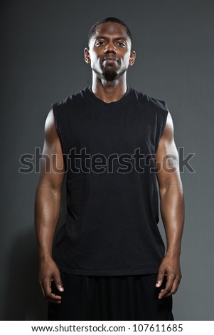 Black american basketball player. Studio portrait isolated on grey background.