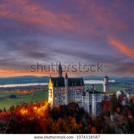 The famous Neuschwanstein castle during sunset, with colorful clouds under sunlight. Dramatik Picturesque scene. fairytale Castle near Munich in Bavaria, Germany. Famous Place for photographers