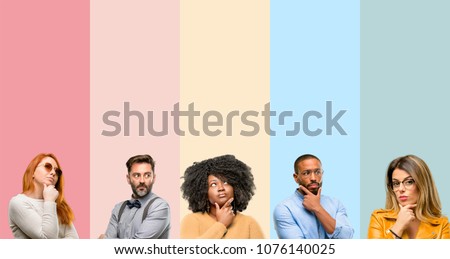 Cool group of people, woman and man doubt expression, confuse and wonder concept, uncertain future Royalty-Free Stock Photo #1076140025