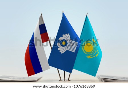 Flags of Russia CIS and Kazakhstan. Cloth of flags is 3d rendering, the rest is a photo.