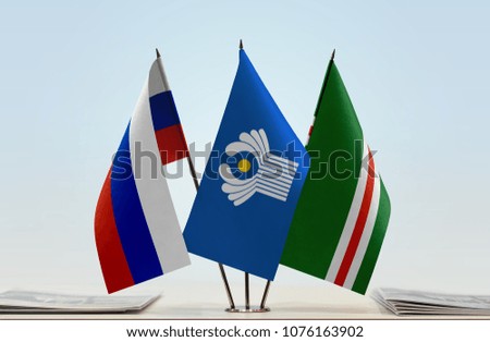 Flags of Russia CIS and Chechen Republic of Ichkeria. Cloth of flags is 3d rendering, the rest is a photo.