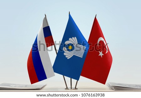 Flags of Russia CIS and Turkey. Cloth of flags is 3d rendering, the rest is a photo.