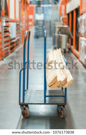 construction cart in the building store. Carts loaded with boards