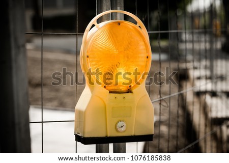Construction site warning light lamp orange fence