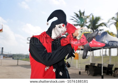 young man in Mardi gras skeleton costume