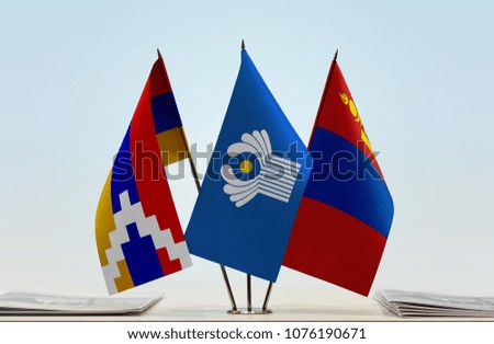 Flags of Nagorno-Karabakh CIS and Mongolia. Cloth of flags is 3d rendering, the rest is a photo.