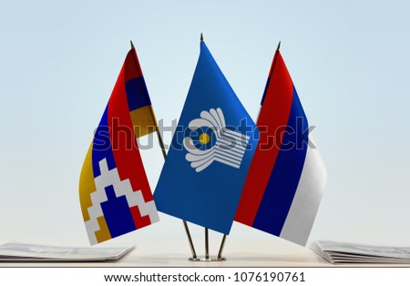 Flags of Nagorno-Karabakh CIS and Serbian Krajina. Cloth of flags is 3d rendering, the rest is a photo.