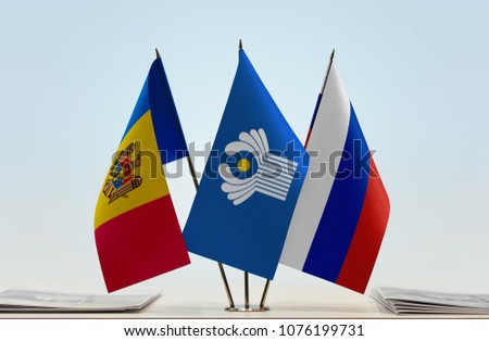 Flags of Moldova CIS and Russia. Cloth of flags is 3d rendering, the rest is a photo.