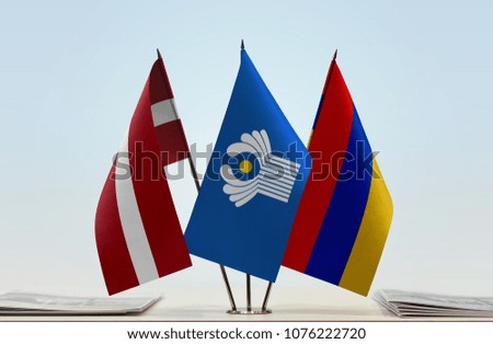 Flags of Latvia CIS and Armenia. Cloth of flags is 3d rendering, the rest is a photo.