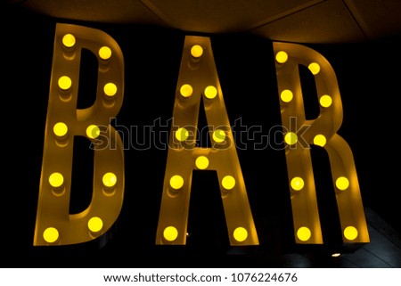 Bar luminous sign letters with bulbs light modern design pub wall background yellow iluminated color restaurant bars decoration